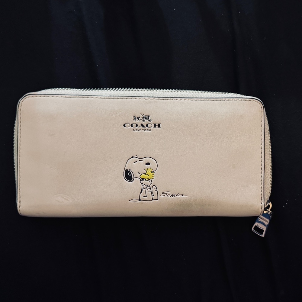 Coach x Peanuts Gang Zipper Wallet featuring Snoopy and Woodstock